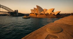 Sydney Opera House at golden hour with the Harbour Bridge behind it